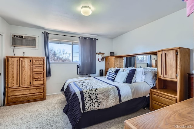 bedroom with carpet floors and a wall mounted air conditioner