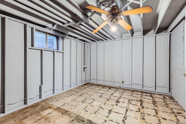 basement with ceiling fan