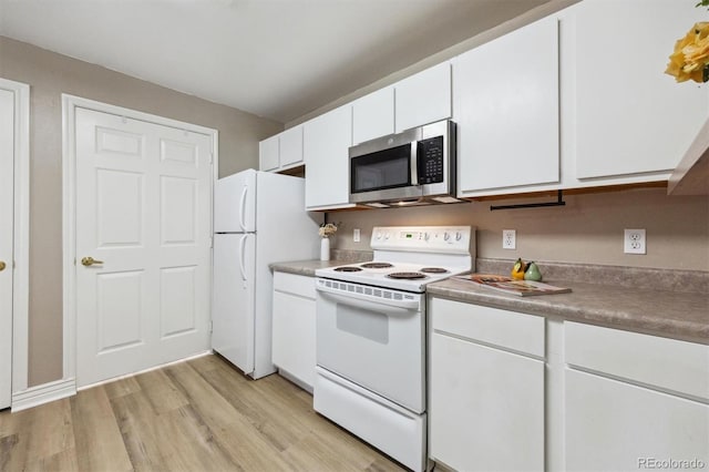 12914 Ironstone Way Unit 102, Parker, CO 80134 - kitchen with white appliances, white cabinets, and light wood-type flooring