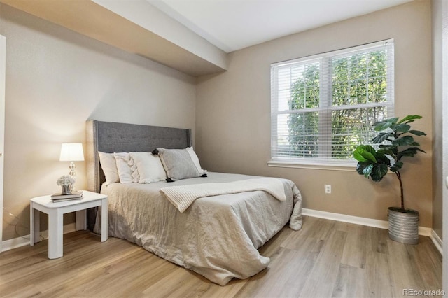 12914 Ironstone Way Unit 102, Parker, CO 80134 - bedroom with wood finished floors and baseboards