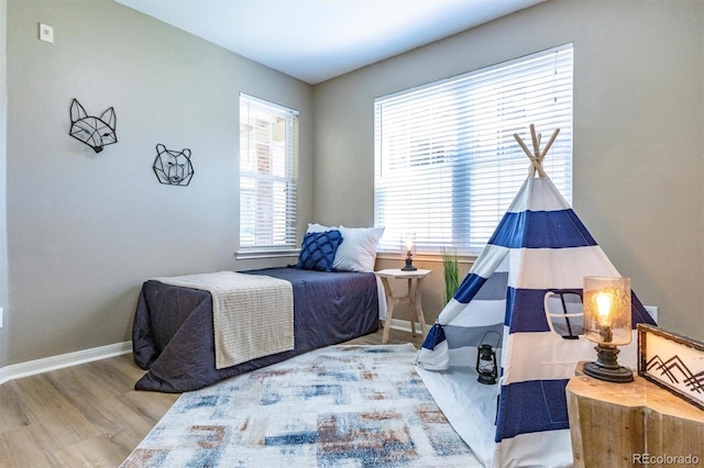 12914 Ironstone Way Unit 102, Parker, CO 80134 - bedroom with wood finished floors and baseboards