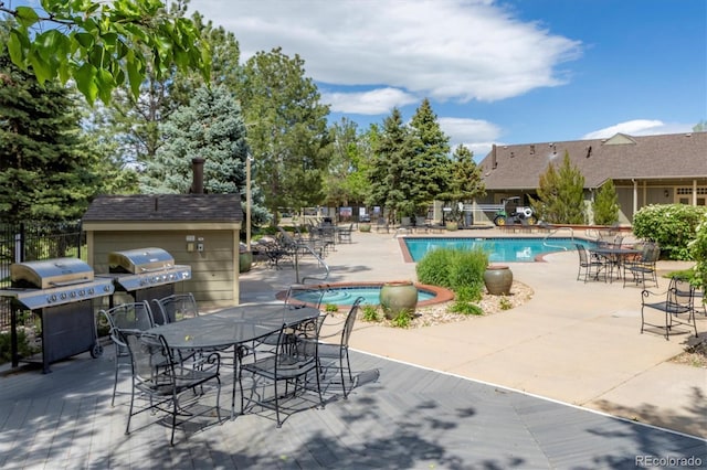 12914 Ironstone Way Unit 102, Parker, CO 80134 - community pool with fence, a patio area, outdoor dining area, and grilling area