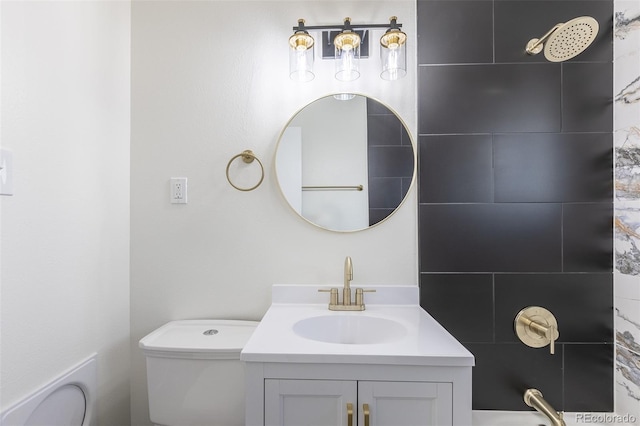 full bathroom featuring vanity, toilet, and a shower