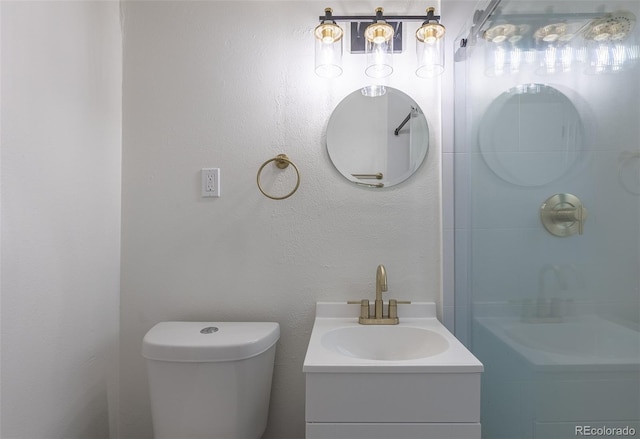 bathroom featuring toilet and vanity