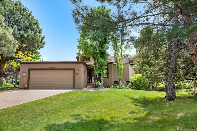 7300 W Stetson Pl Unit 46, Littleton, CO 80123 - view of front facade with an attached garage, driveway, and a front yard