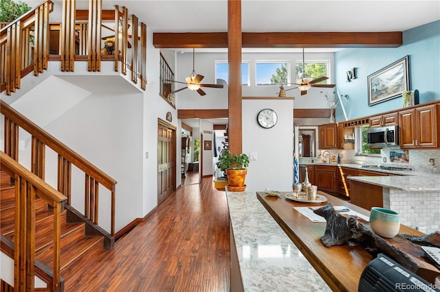 7300 W Stetson Pl Unit 46, Littleton, CO 80123 - entryway with ceiling fan, a high ceiling, beamed ceiling, stairs, and dark wood-style floors