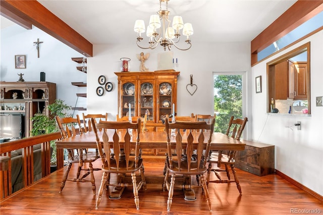 7300 W Stetson Pl Unit 46, Littleton, CO 80123 - dining area with wood finished floors, a chandelier, and beam ceiling