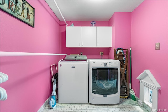 7300 W Stetson Pl Unit 46, Littleton, CO 80123 - laundry area featuring cabinet space, washer and dryer, light tile patterned floors, and baseboards