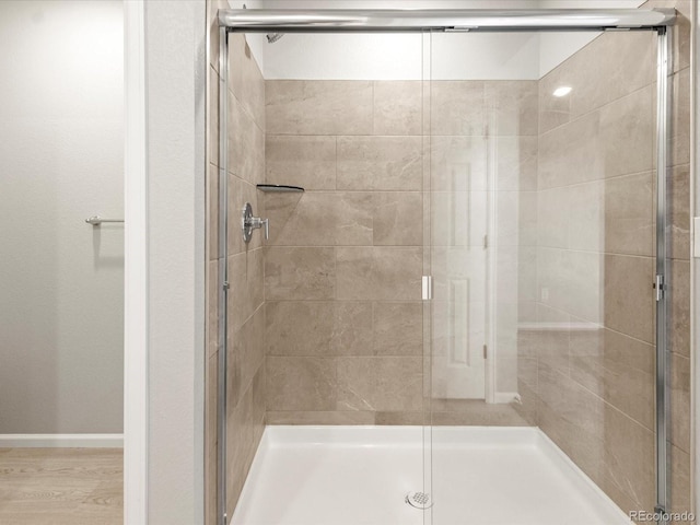 bathroom featuring an enclosed shower