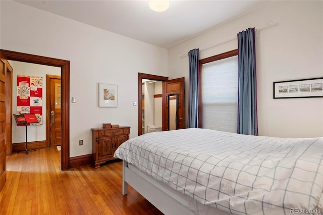 328 S Lincoln St, Denver, CO 80209 - bedroom with light wood finished floors and baseboards