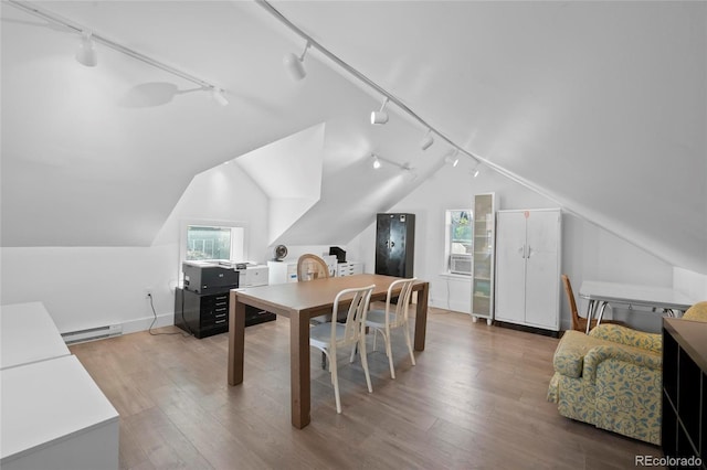 328 S Lincoln St, Denver, CO 80209 - office area featuring rail lighting, vaulted ceiling, wood finished floors, and baseboard heating
