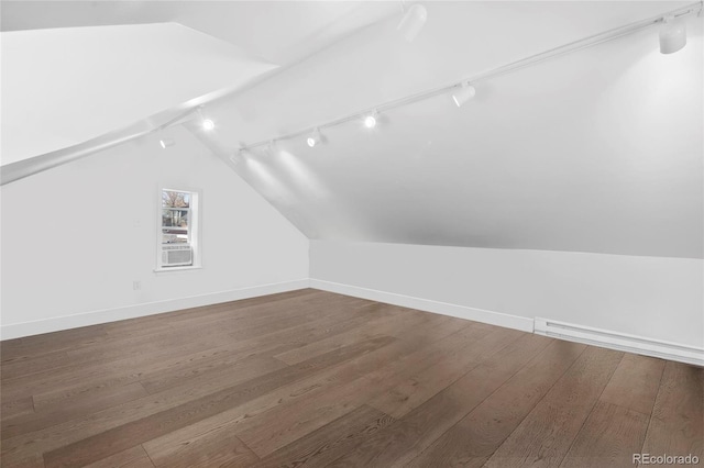 328 S Lincoln St, Denver, CO 80209 - additional living space featuring vaulted ceiling, wood finished floors, and baseboards