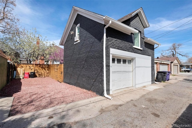 328 S Lincoln St, Denver, CO 80209 - view of home's exterior with brick siding and an attached garage