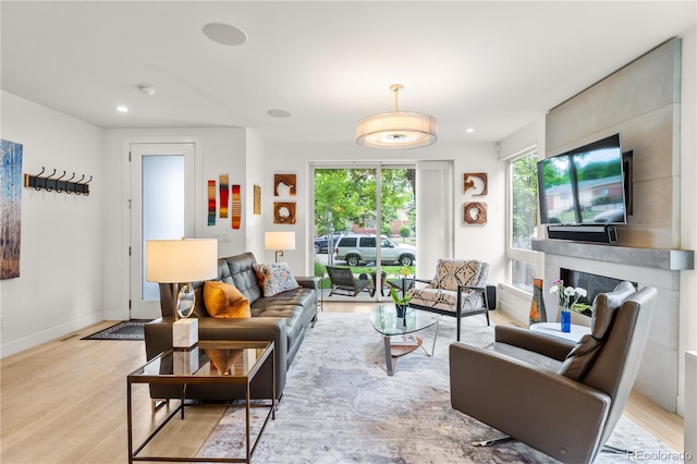 3612 Wyandot St, Denver, CO 80211 - living room featuring light wood-style flooring, recessed lighting, and baseboards