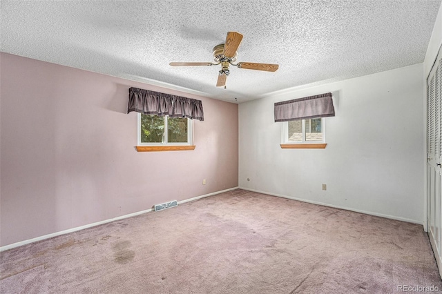 10171 W 69th Ave, Arvada, CO 80004 - spare room featuring carpet flooring, ceiling fan, and a textured ceiling
