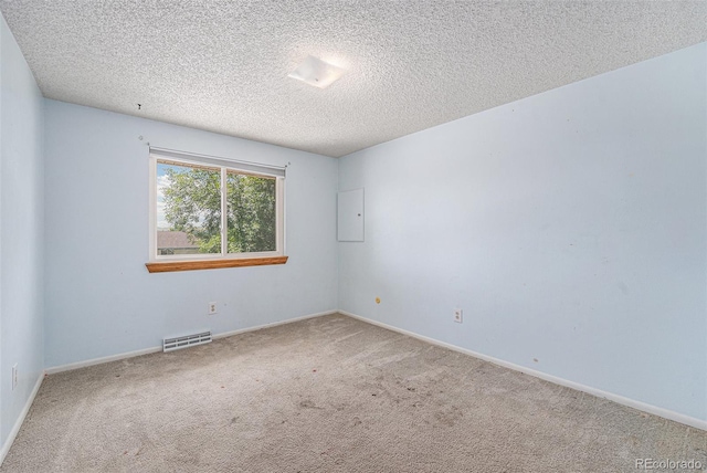 10171 W 69th Ave, Arvada, CO 80004 - empty room with carpet flooring, a textured ceiling, and electric panel
