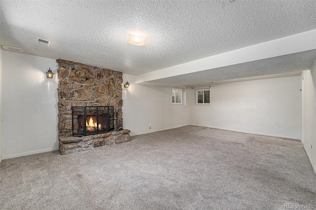 10171 W 69th Ave, Arvada, CO 80004 - unfurnished living room featuring a textured ceiling, a fireplace, and carpet flooring