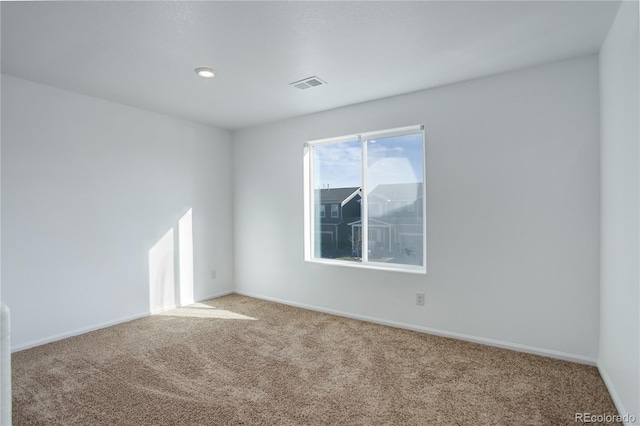 empty room with carpet flooring