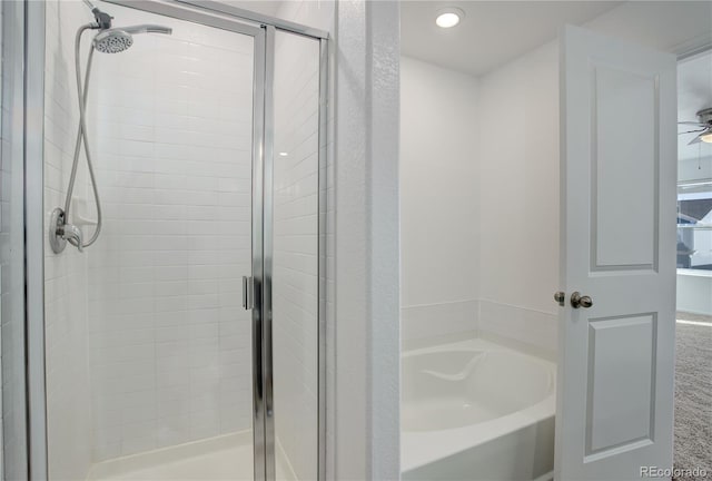 bathroom with shower with separate bathtub