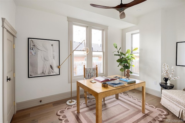 3142 W 26th Ave, Denver, CO 80211 - home office with light wood-type flooring, ceiling fan, and baseboards