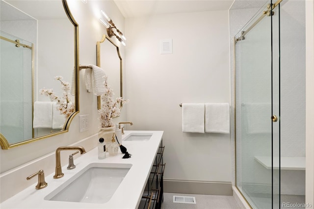 3142 W 26th Ave, Denver, CO 80211 - bathroom featuring double vanity, a shower with door, and baseboards