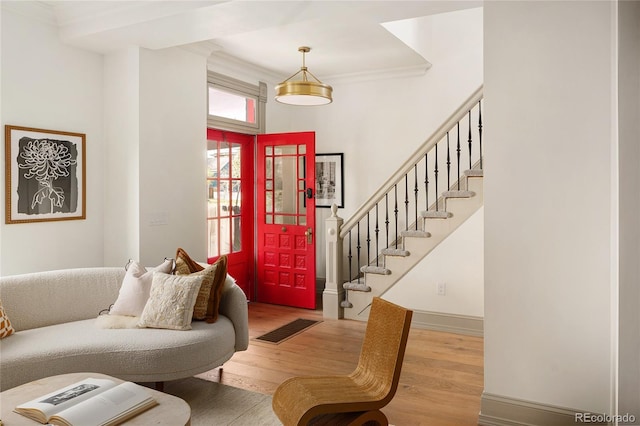 3142 W 26th Ave, Denver, CO 80211 - foyer entrance featuring wood finished floors, ornamental molding, stairs, and baseboards