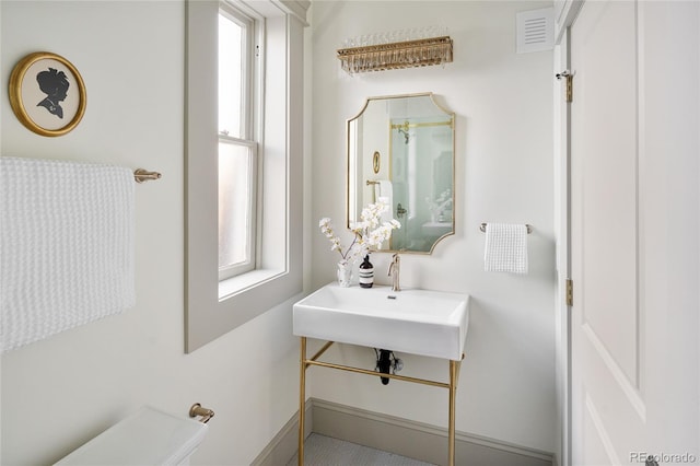3142 W 26th Ave, Denver, CO 80211 - bathroom featuring plenty of natural light, toilet, and a sink