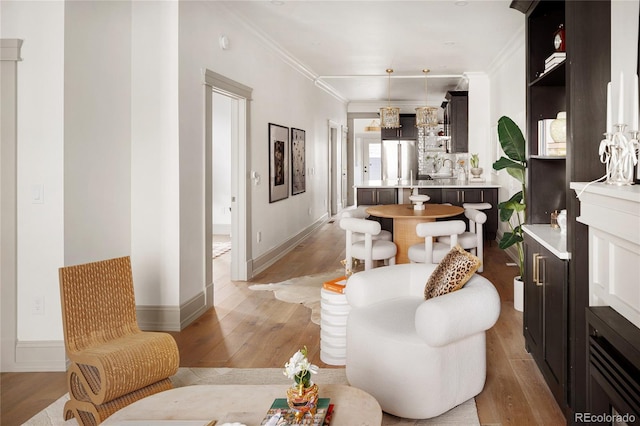 3142 W 26th Ave, Denver, CO 80211 - living area featuring ornamental molding, light wood-style flooring, and baseboards