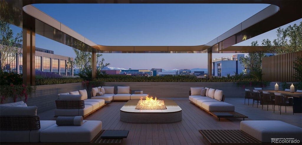 patio terrace at dusk featuring an outdoor living space with a fire pit