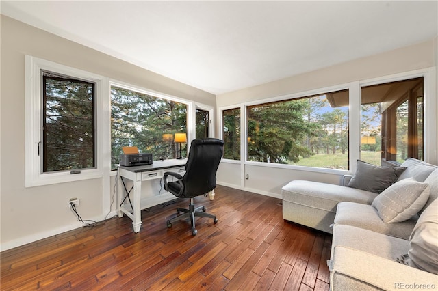 home office with dark hardwood / wood-style flooring