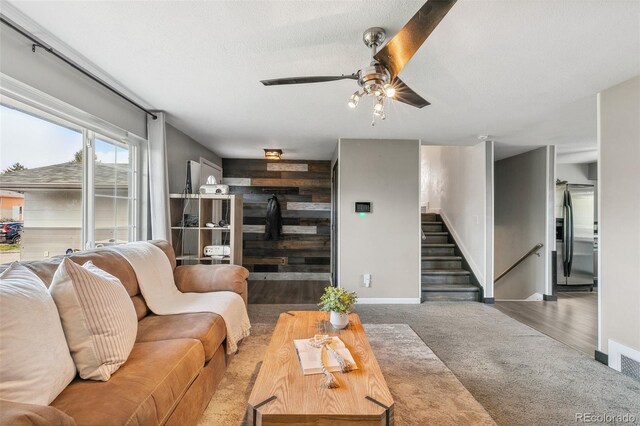 4475 London Ln, Colorado Springs, CO 80916 - living room with stairway, baseboards, carpet, and a ceiling fan