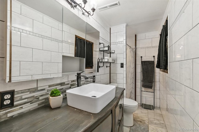 4475 London Ln, Colorado Springs, CO 80916 - bathroom with vanity, toilet, tile walls, a shower with curtain, and visible vents
