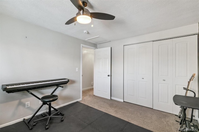 4475 London Ln, Colorado Springs, CO 80916 - workout room featuring baseboards, attic access, a textured ceiling, a ceiling fan, and carpet