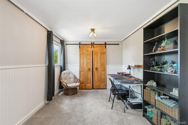 4475 London Ln, Colorado Springs, CO 80916 - home office with carpet floors, a barn door, wainscoting, and crown molding