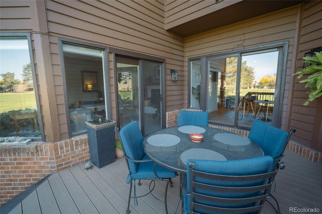 deck with outdoor dining area