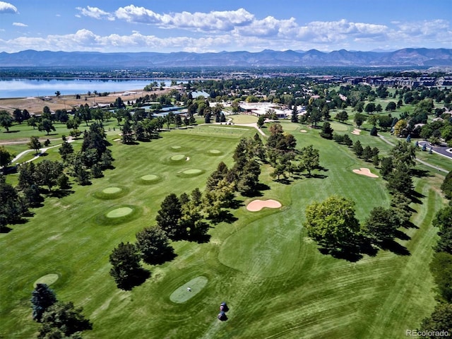 birds eye view of property featuring view of golf course and a water and mountain view