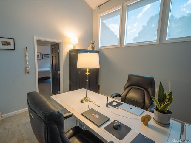 carpeted office featuring a wealth of natural light and baseboards