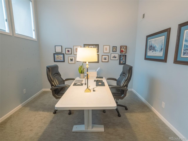 office area featuring carpet and baseboards