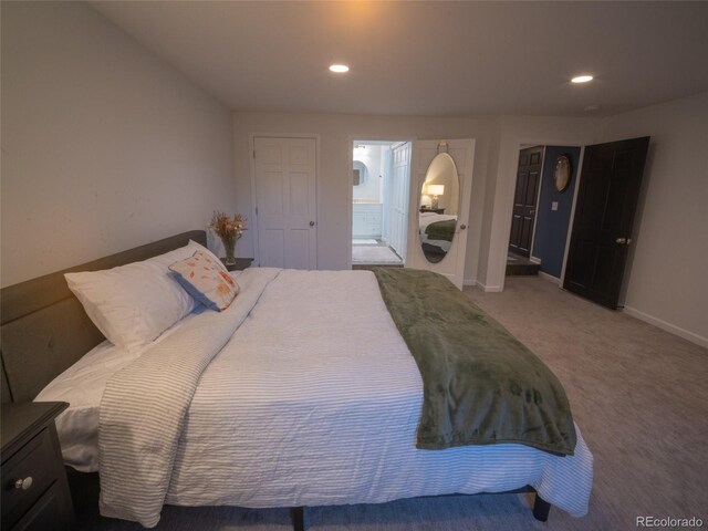 bedroom with connected bathroom, baseboards, carpet flooring, and recessed lighting