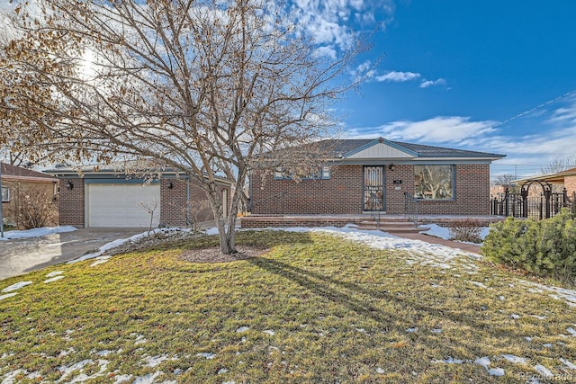 ranch-style home with a garage and a front lawn