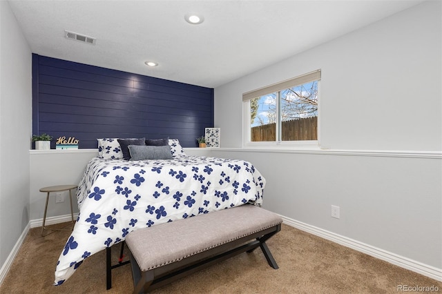 carpeted bedroom with visible vents, recessed lighting, and baseboards