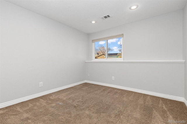 carpeted empty room with recessed lighting, visible vents, and baseboards