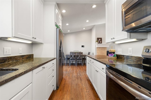 kitchen with white cabinets, recessed lighting, and appliances with stainless steel finishes