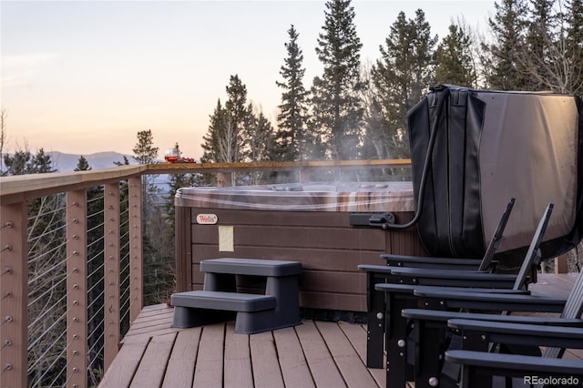 wooden terrace with a hot tub