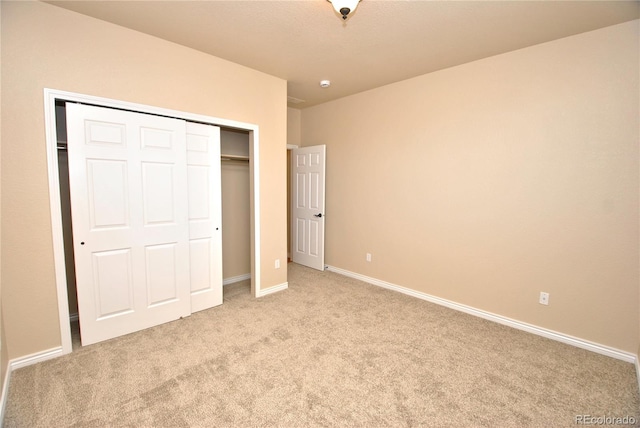 10835 Tincup Creek Pt, Colorado Springs, CO 80908 - unfurnished bedroom featuring light carpet, a closet, and baseboards