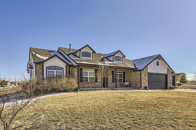 view of front of home featuring concrete driveway, brick siding, an attached garage, and a front yard