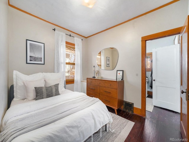 bedroom featuring dark hardwood / wood-style floors and ornamental molding