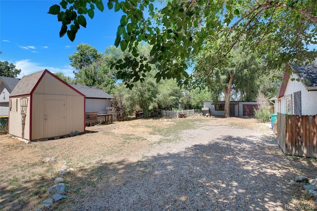 view of yard with a shed