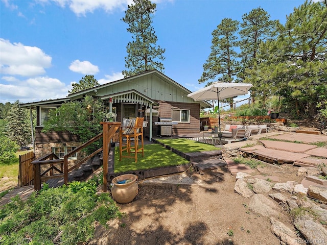 27385 Spruce Ln, Evergreen, CO 80439 - rear view of property with an outdoor hangout area and a patio