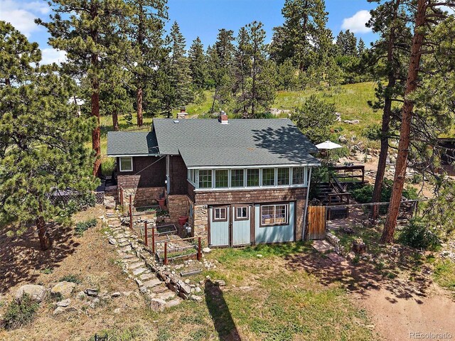 27385 Spruce Ln, Evergreen, CO 80439 - view of front of house featuring stairway, roof with shingles, and stone siding